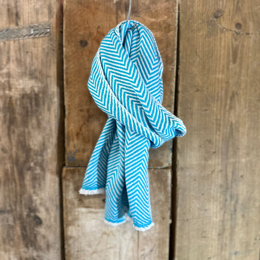blue and white cashmere scarf on wooden background